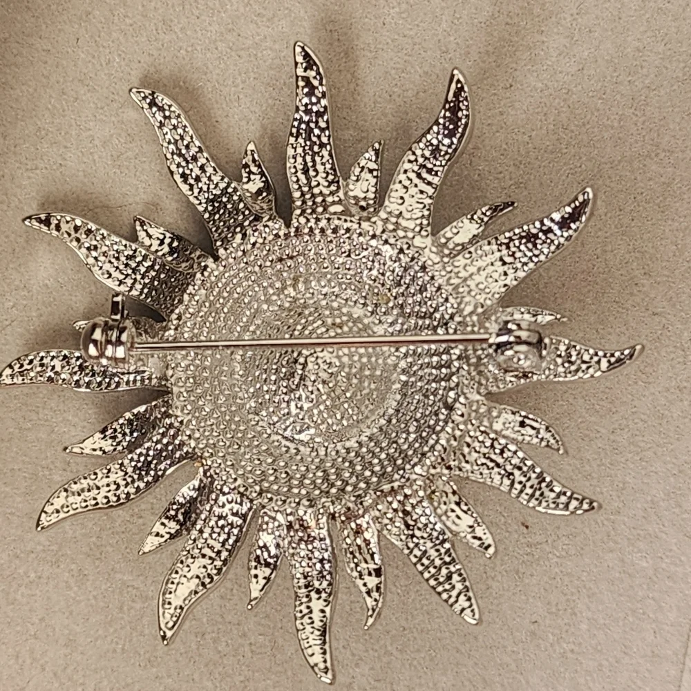 Silver and Blue Starburst Sun Brooch Pin